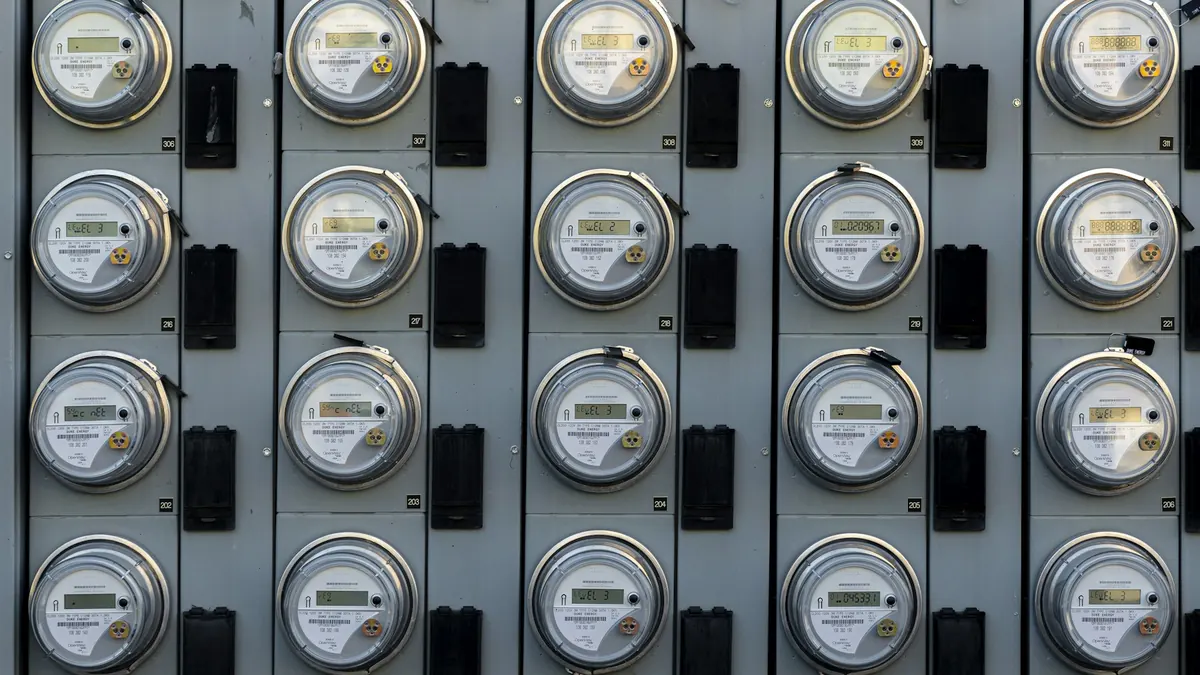 Rows of electricity meters on a wall