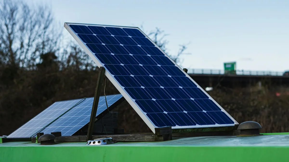 Solar panel tilted on a frame against a blue sky
