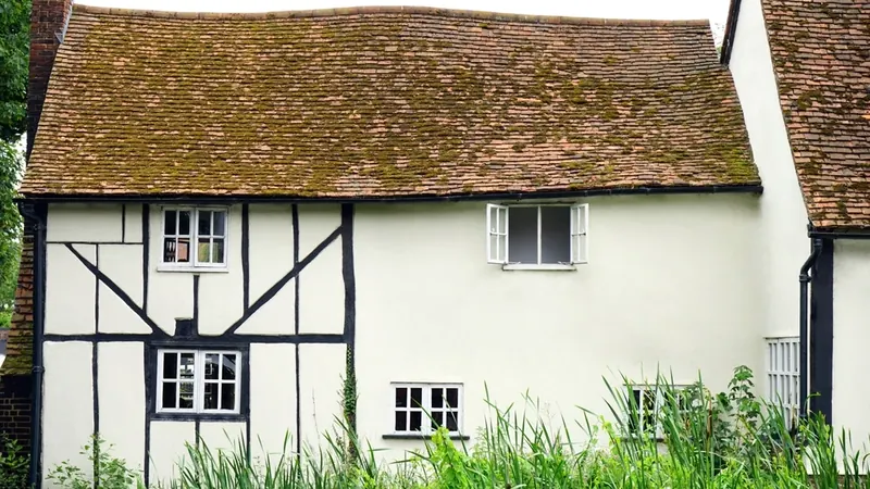White timber-framed cottage in the English countryside